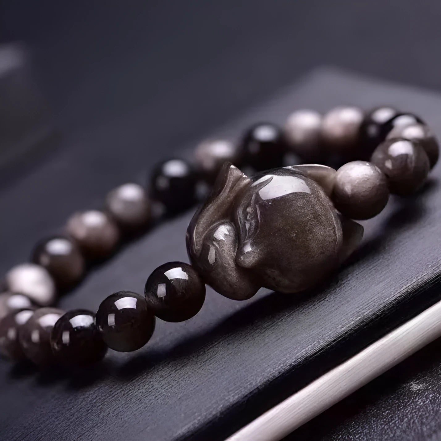 Obsidian fox bracelet with 8mm polished bead and fox charm on black elastic cord