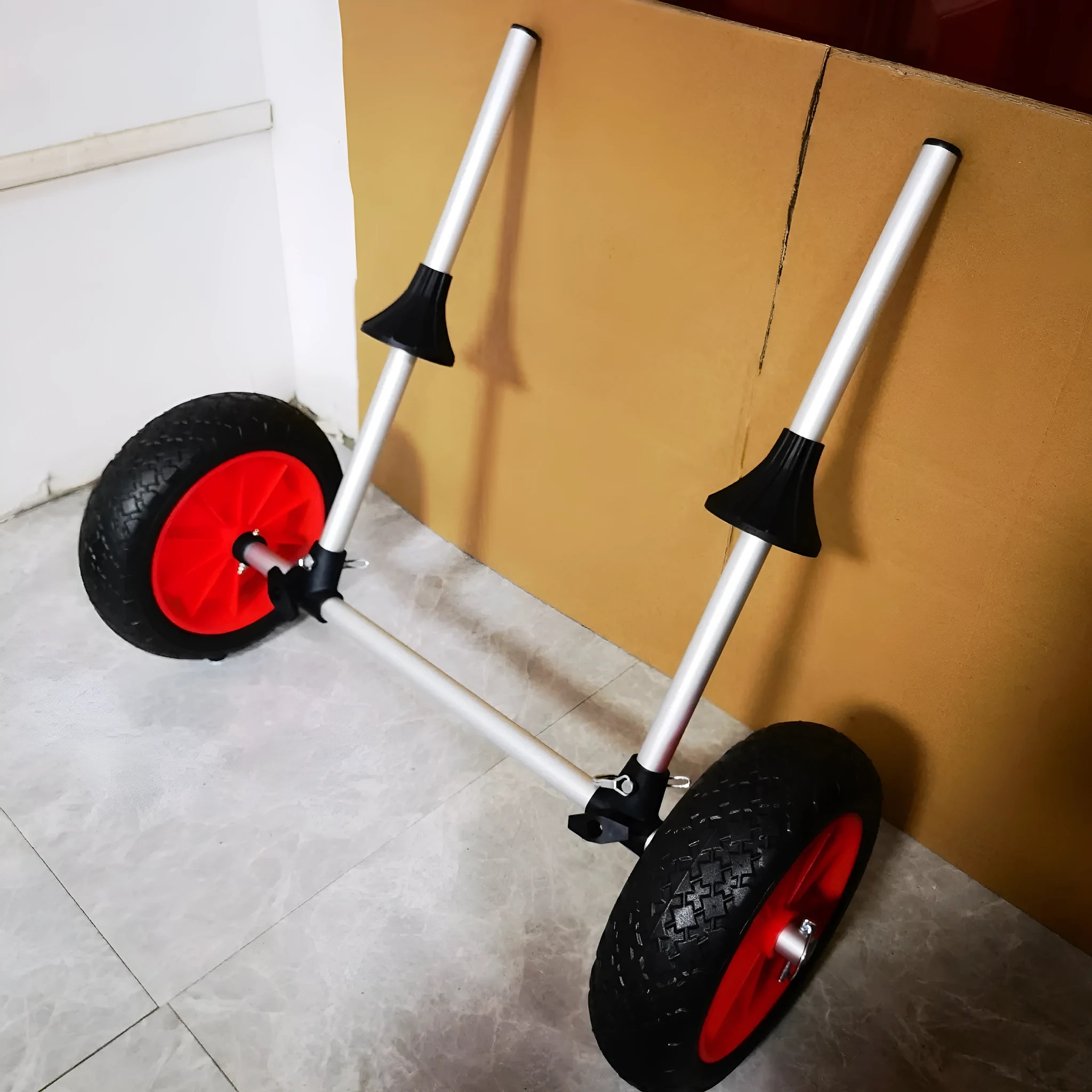 Foldable kayak beach trailer cart with upright pole, made from silver aluminium alloy tubing and black rubber.