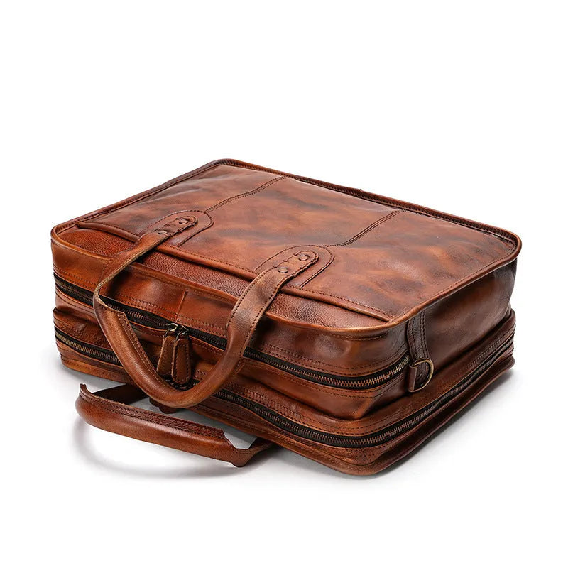 Men's vintage leather briefcase in black showing internal organisation pockets and 42cm width