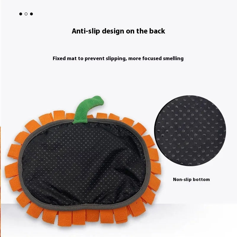 Orange pumpkin-shaped pet training mat on floor with dog treats scattered across polar fleece surface