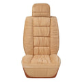 Short plush winter car seat cushion in grey, shown on a car seat.