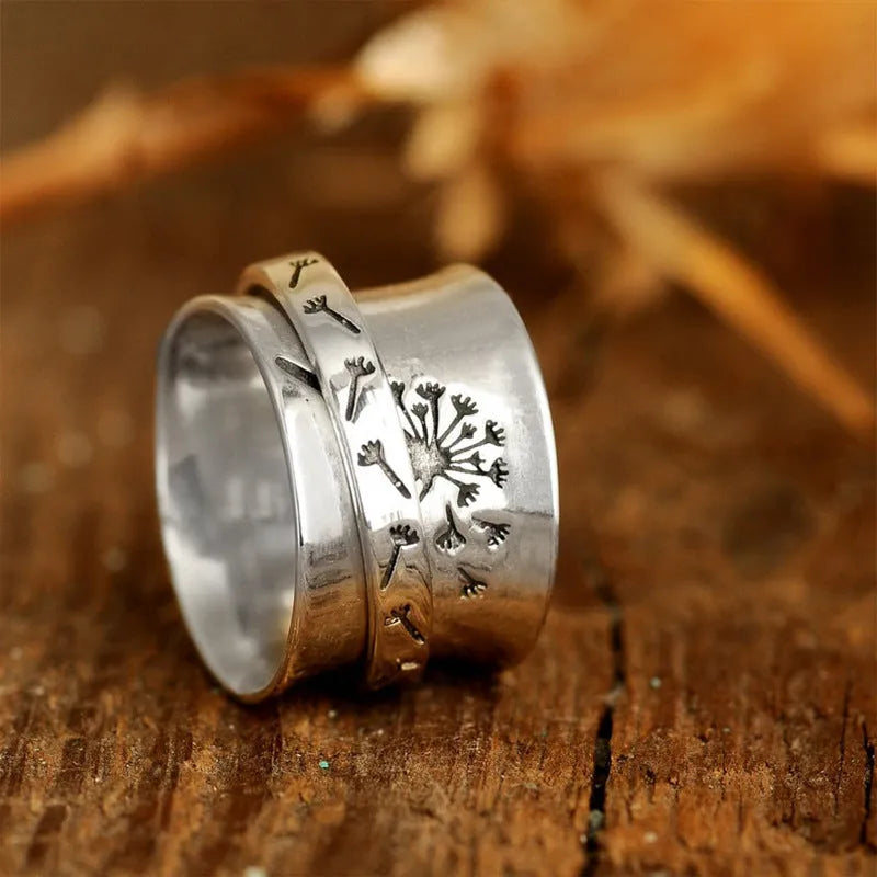 Silver rotatable flower ring with adjustable floral decoration on alloy band