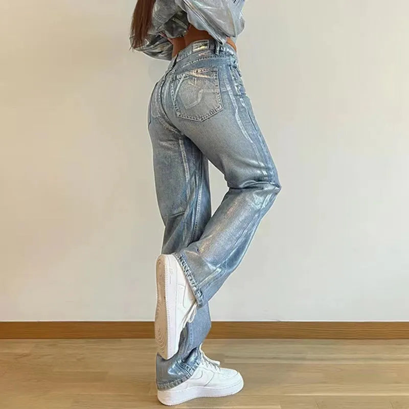 High waist straight leg blue jeans with hot silver contrast details on a model, showing the street hipster style.