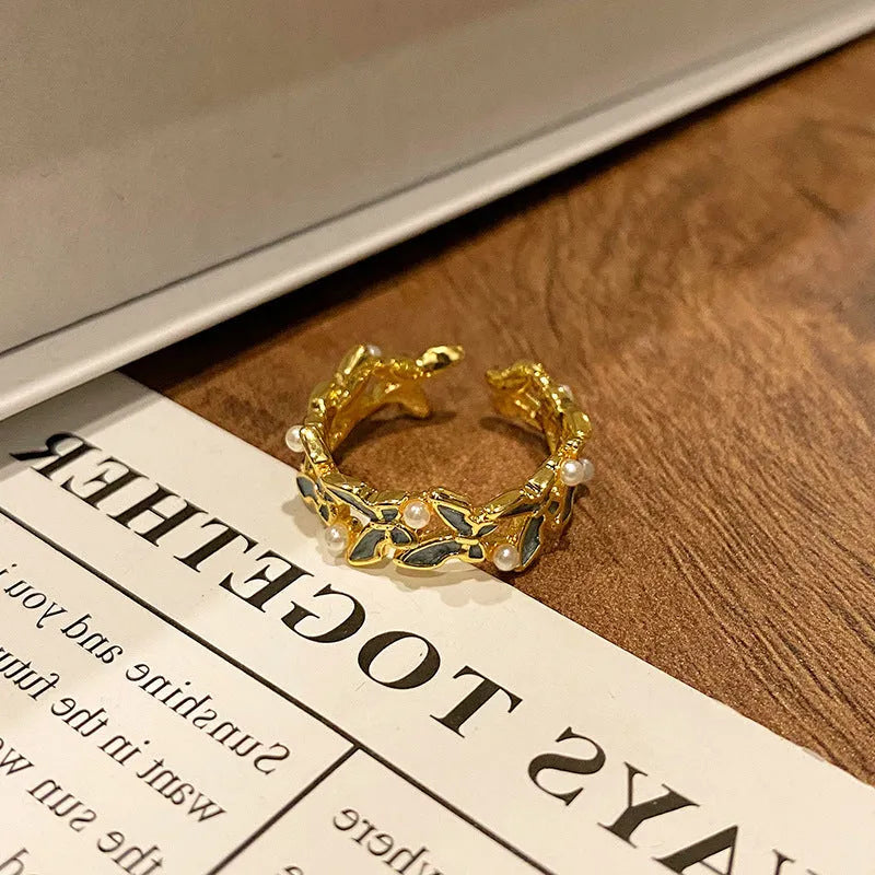 Butterfly design copper ring with oil-drip textured finish in women's jewellery