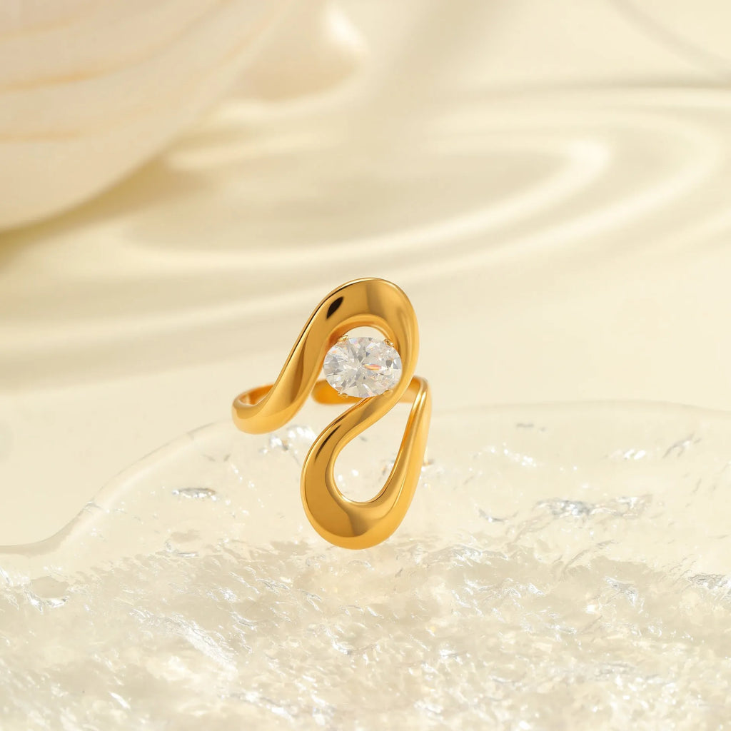 Women's geometric zircon ring with adjustable open mouth design on a hand.