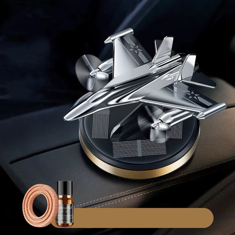 Solar powered rotating silver fighter jet perfume ornament with aluminium alloy seat and essential oil.