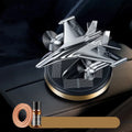 Solar powered rotating silver fighter jet perfume ornament with aluminium alloy seat and essential oil.