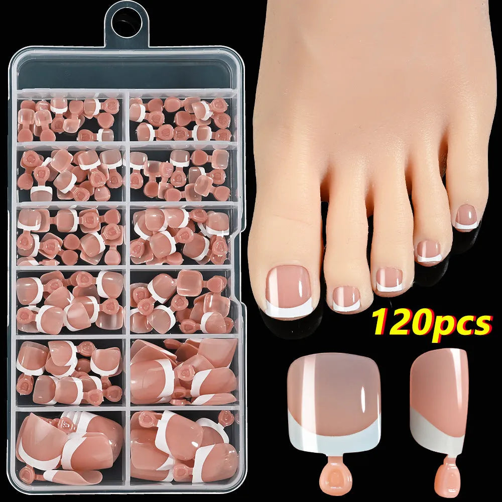 120-piece box of French white tip false toenails in nude colours, square short shape.