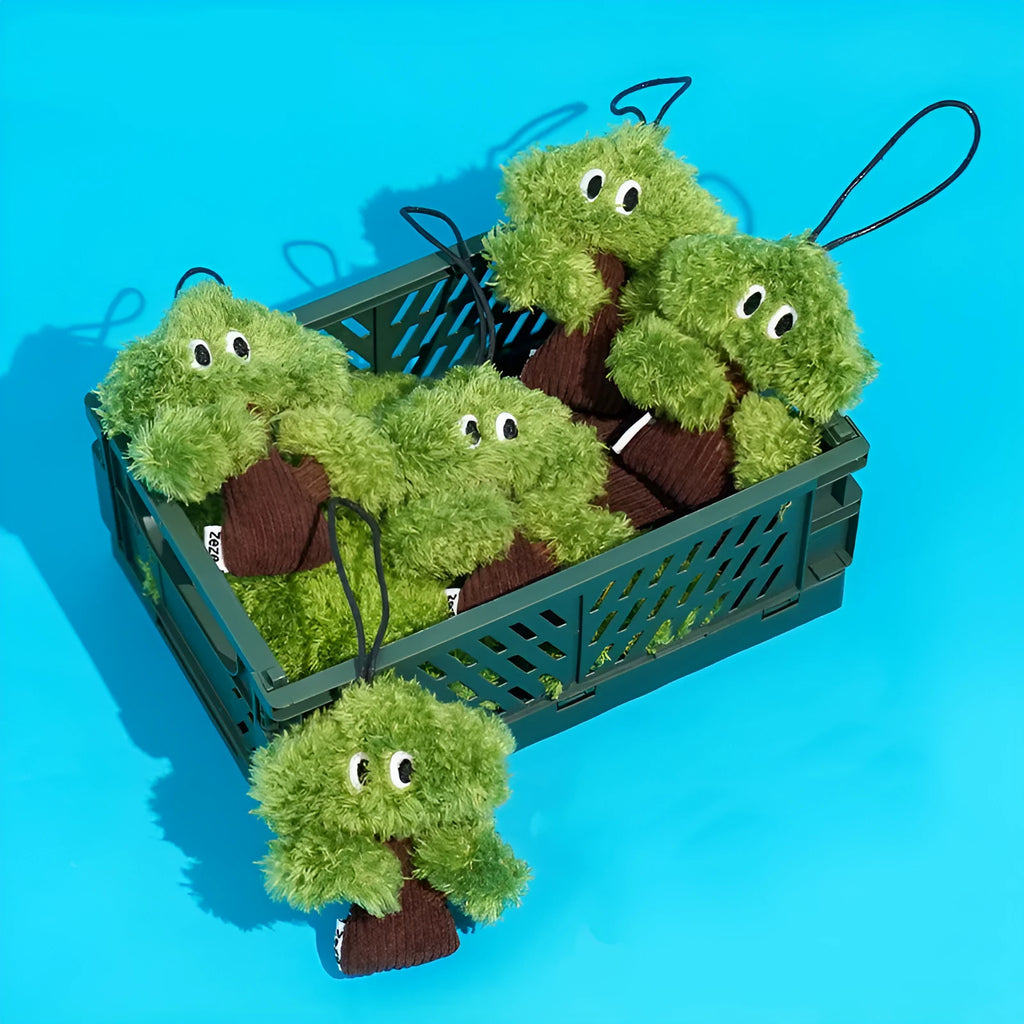 Plush pine tree-shaped cat toy with mint filling, shown in three available sizes for feline biting and grinding play.