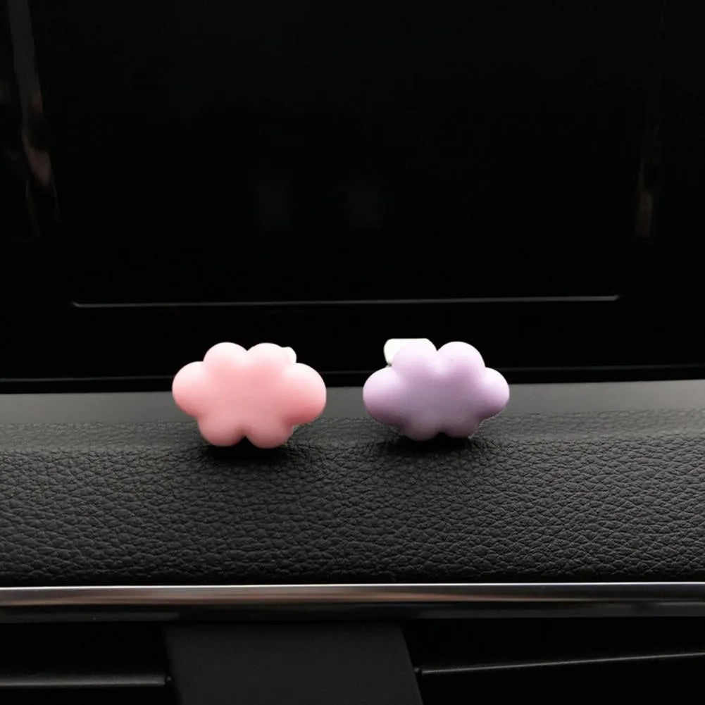 Baiyun cartoon car fragrance clip in resin, shown in various colours for air vent mounting.