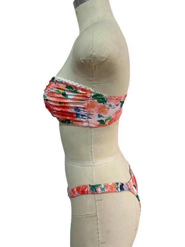 Blue floral print tube top bikini set with lace trim on a mannequin.