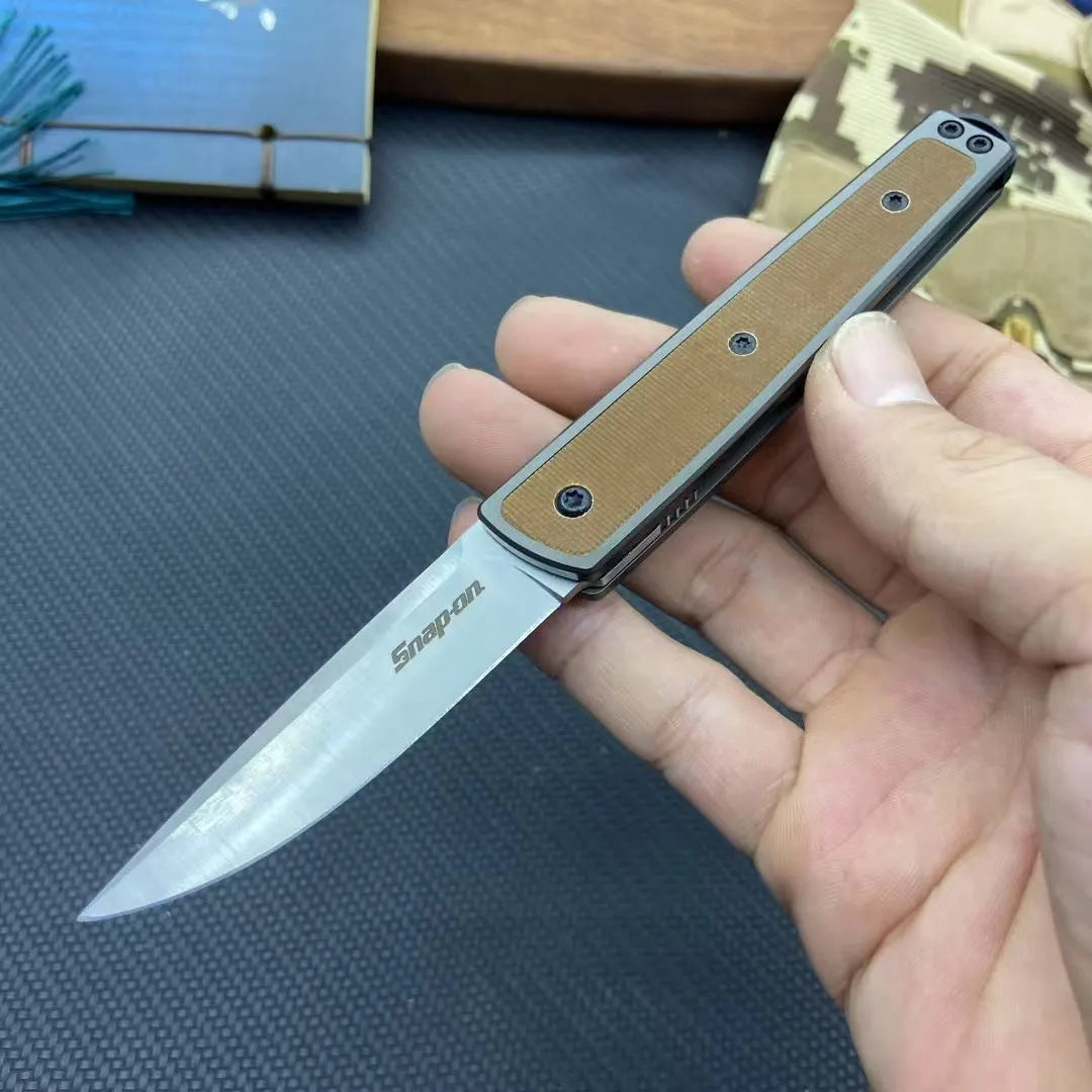Folding fruit knife with stainless steel blade extended, showing black handle variant with blade measurements