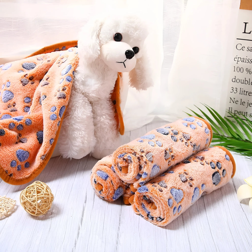 Coral fleece pet blanket with dog paw print pattern available in multiple colours and sizes for dogs and cats