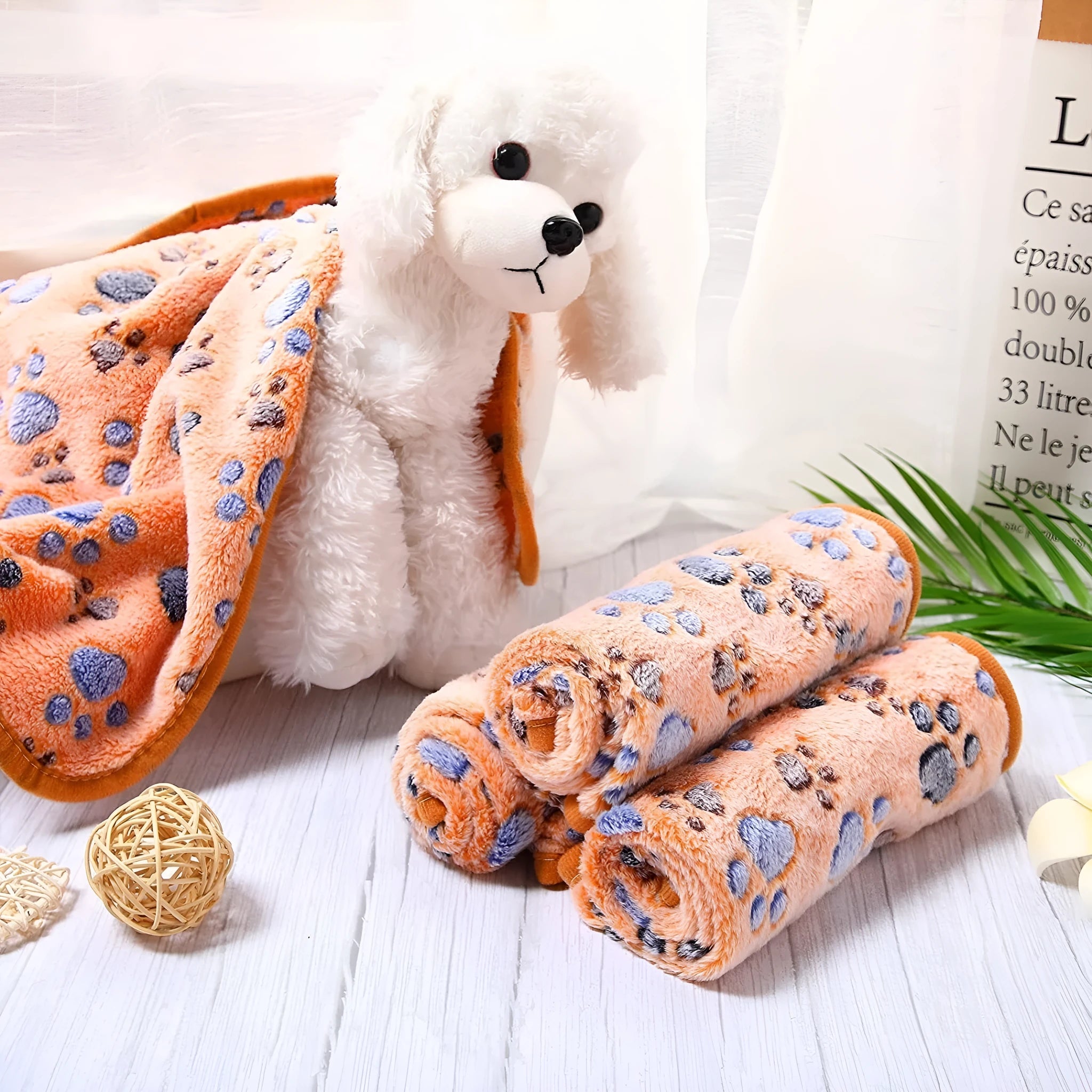 Coral fleece pet blanket with dog paw print pattern available in multiple colours and sizes for dogs and cats