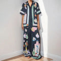 Black women's cartoon print casual set with cardigan and matching trousers