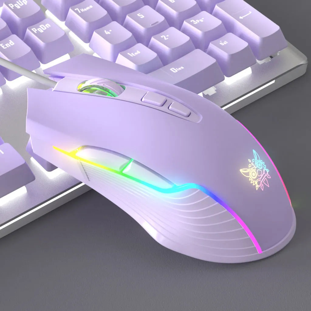 Purple and white mechanical keyboard and mouse wired set with backlight illumination on desktop