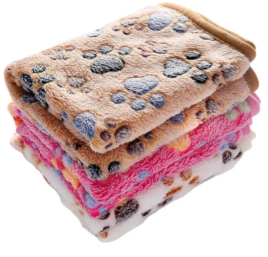 Coral fleece pet blanket with dog paw print pattern available in multiple colours and sizes for dogs and cats