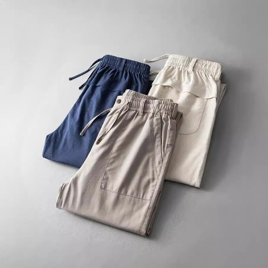 Men's linen casual trousers in navy blue, apricot hemp grey, and grey colours with mid waist design