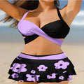 Women's purple bikini set with lace-up design featuring sleeveless top and high-waist split skirt