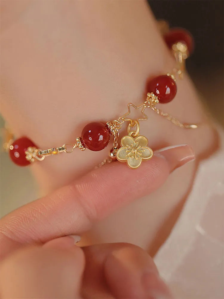 Red agate double layer women's bracelet with floral and peach blossom designs on natural stone