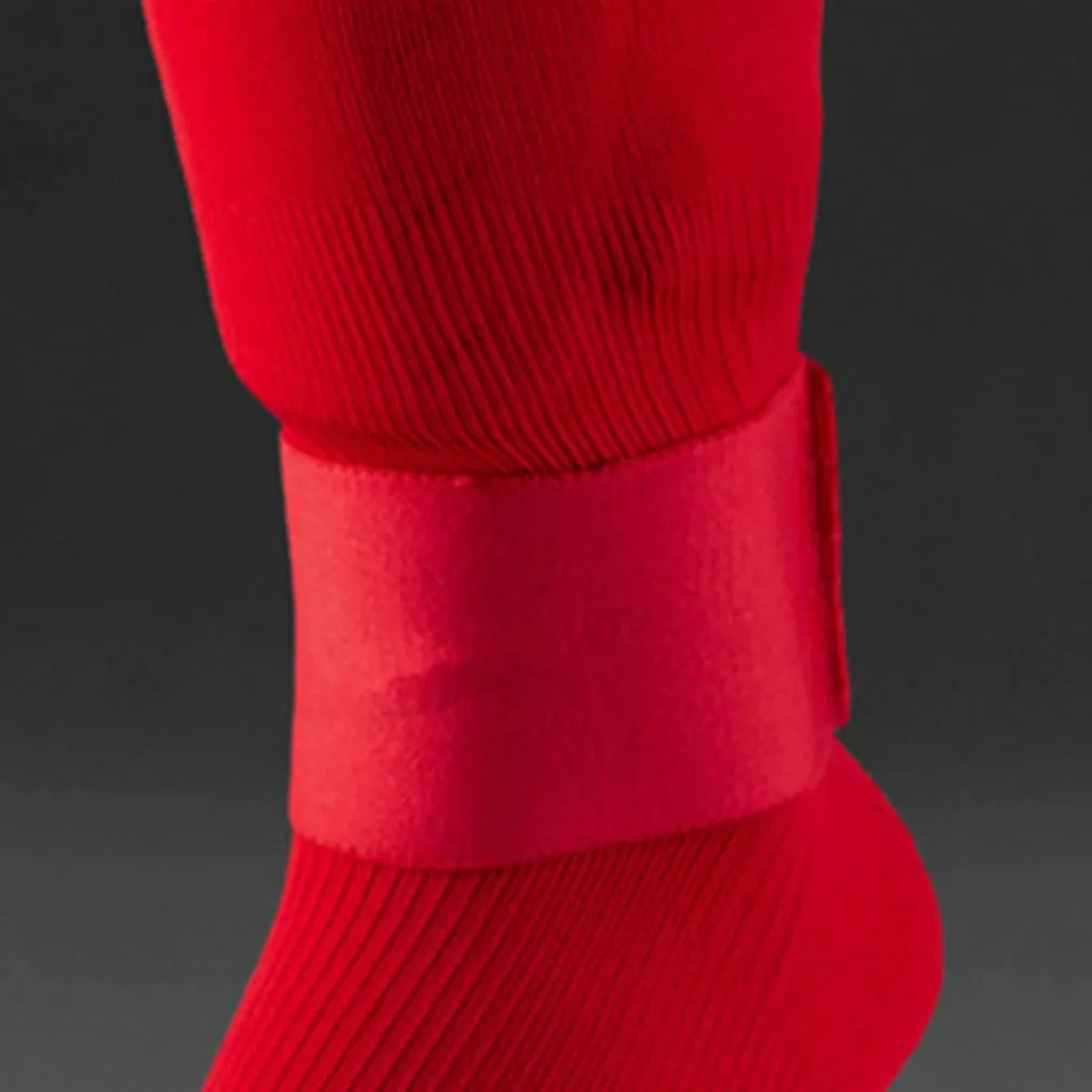Rubber football shin guard fixation strap shown in multiple colours with approximate 25x6.5cm dimensions