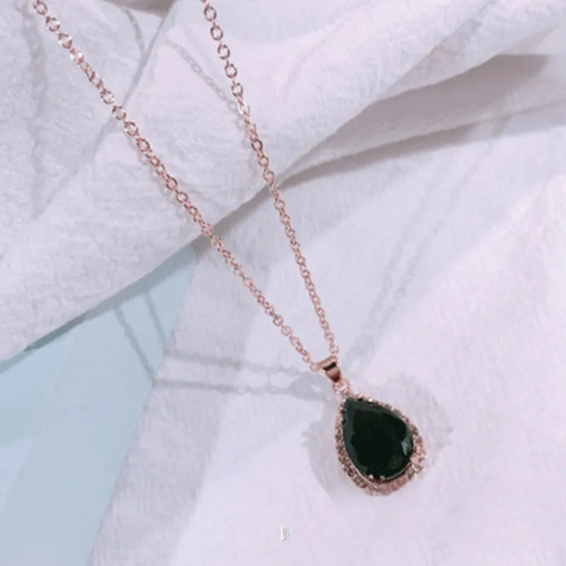 Rose gold plated drop pendant necklace with colourful rhinestones in a pink colour option.