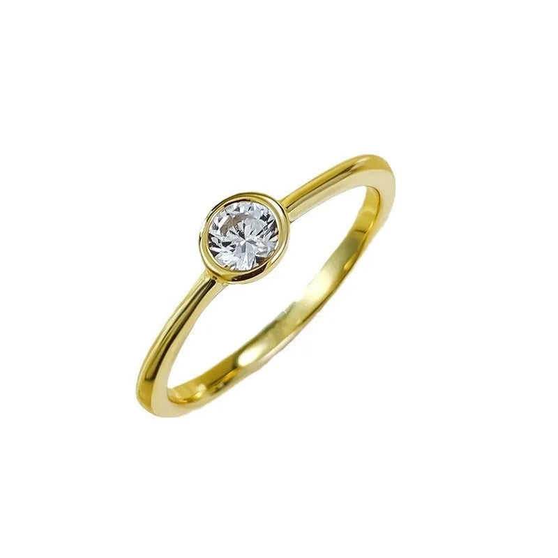 Minimalist crown-shaped silver ring with line detailing, shown in electroplated gold and platinum finishes