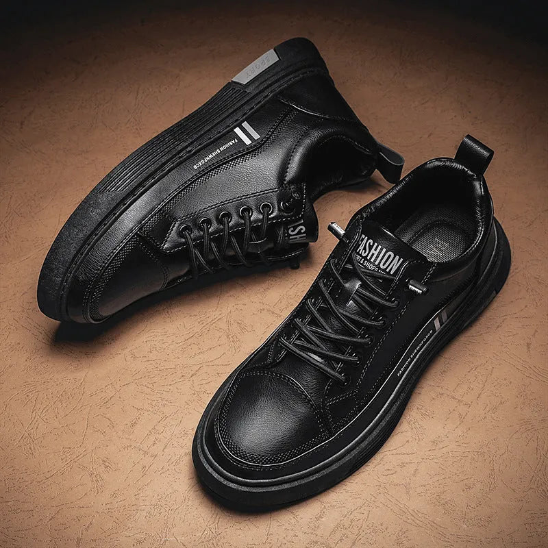 Men's low-top skate shoes in black with elastic band fastening and round toe.