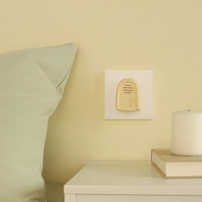 Wireless plug-in doorbell with self-generating signal system in milky yellow and white colour options