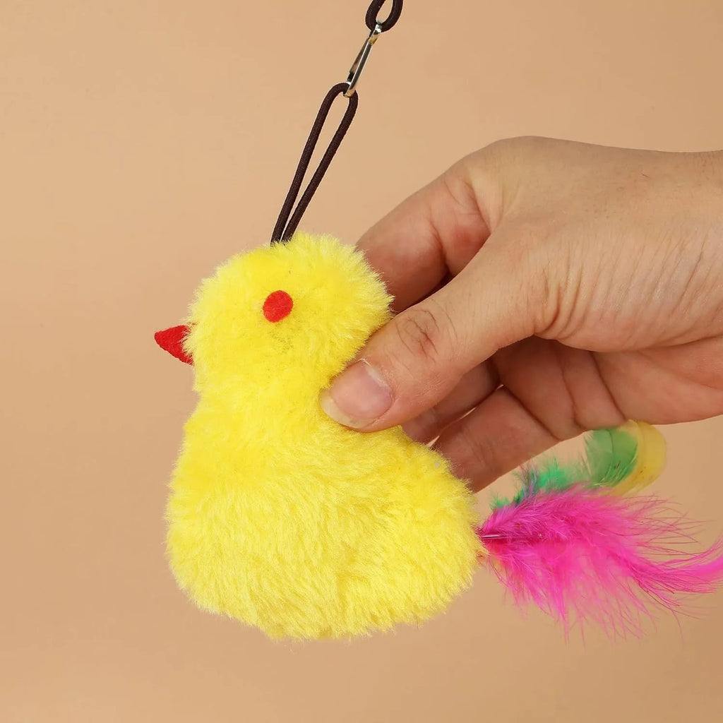 Interactive cat toy hanging from door frame with elastic rope, treat dispenser bulb, and dangling mouse accessory