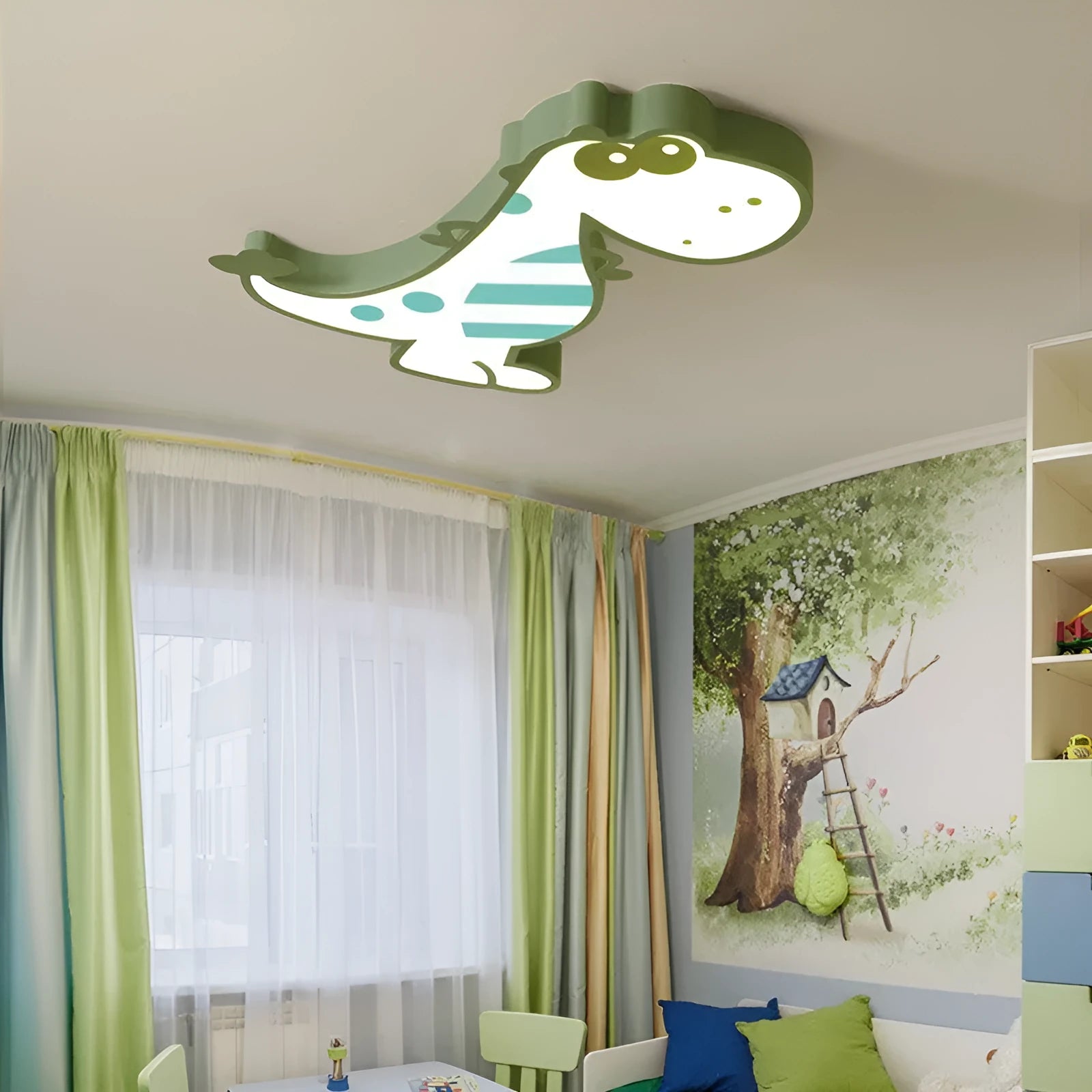 Green cartoon dinosaur ceiling light with dimmer switch on a white ceiling.