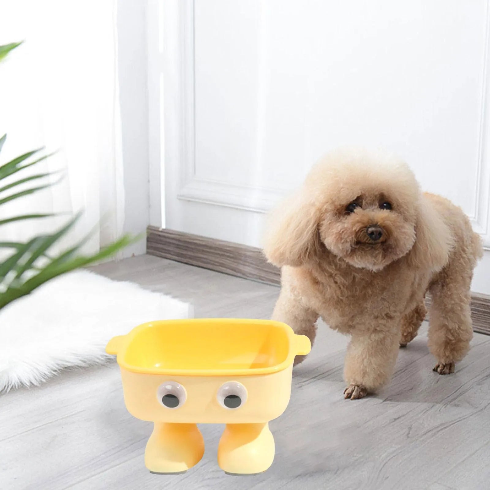 Green robot-shaped elevated cat bowl with tilted dish and non-slip base