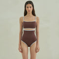 Brown one-piece swimsuit for women with triangle neckline on a mannequin
