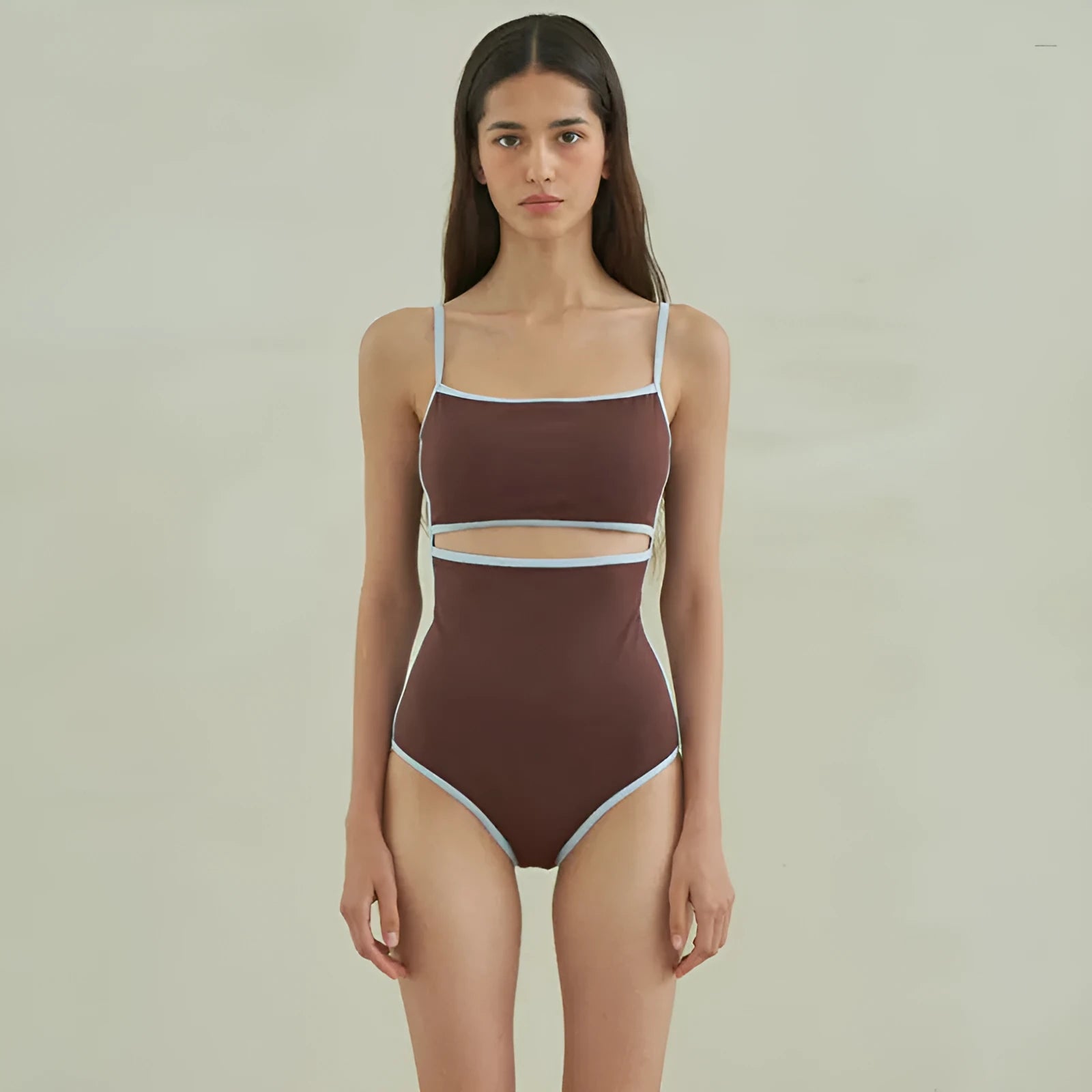Brown one-piece swimsuit for women with triangle neckline on a mannequin