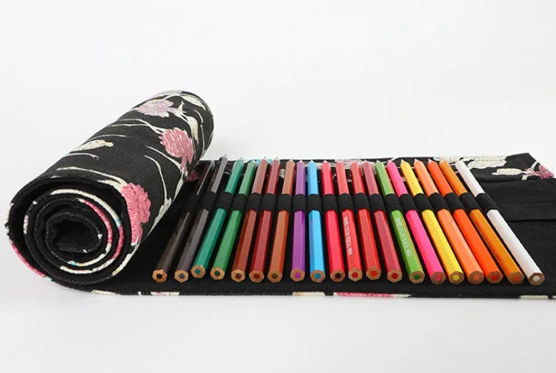 Square canvas rolling pencil case with ballet girl print, showing multiple pencil slots inside.