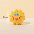 Four coloured natural latex squeaky dog balls with cute faces, each measuring 7.5cm