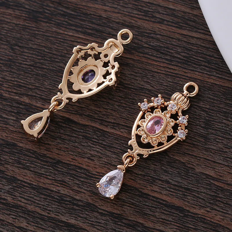 Hollow water drop shaped pendant with micro inlaid zircon on a crown outline in five colour options.