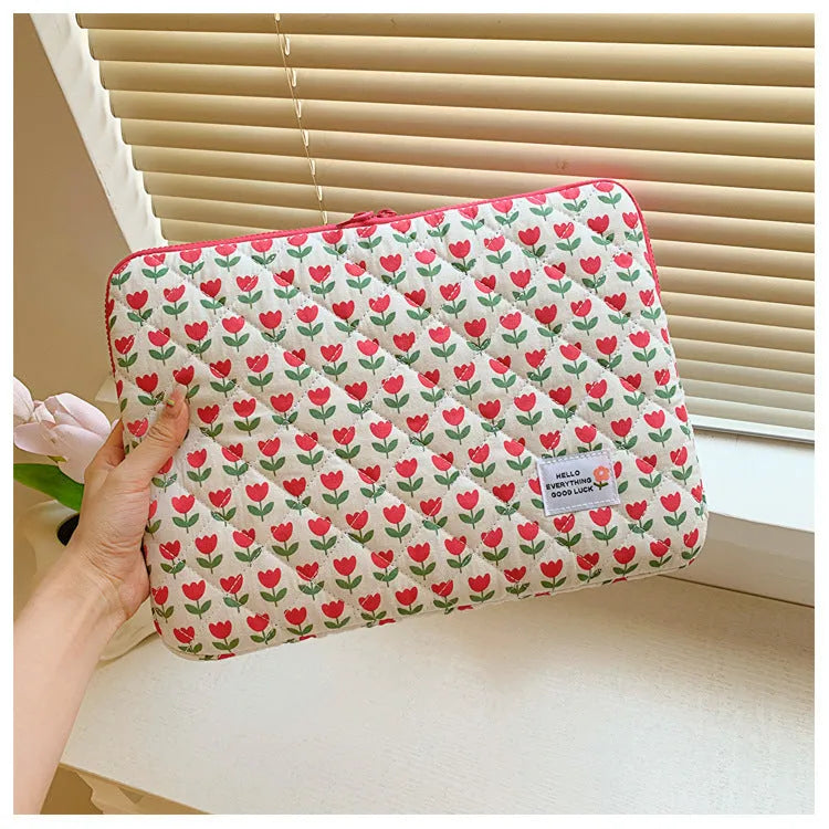 Women's floral print laptop bag in green flower pattern showing storage compartments