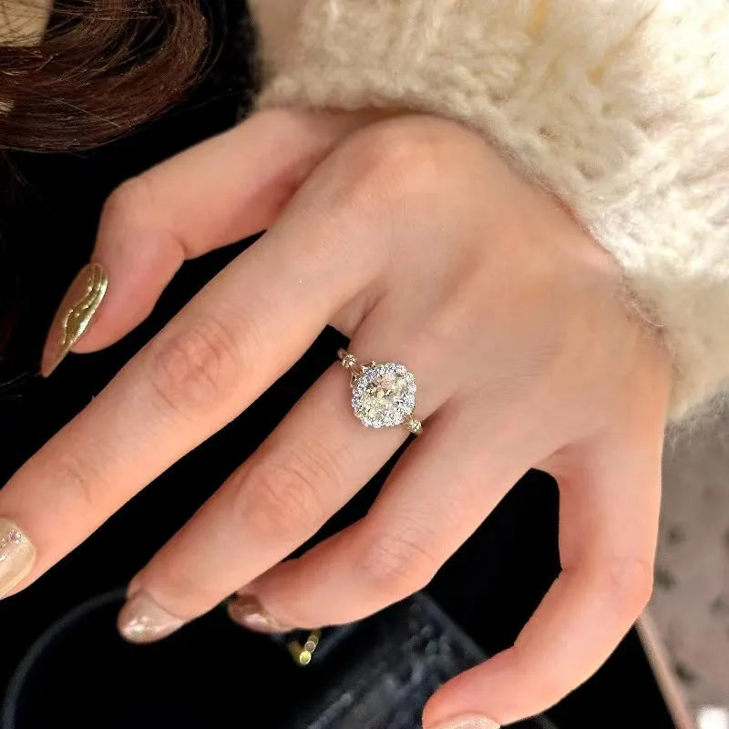Silver geometric bridal bouquet ring with adjustable opening on index finger