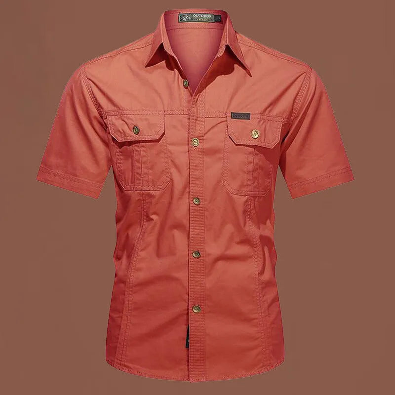 Men's army green cotton work shirt with short sleeves and a loose, non-iron fit.