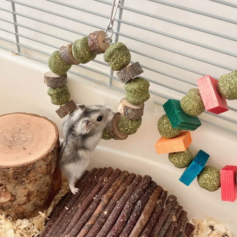 Hamster chew toy featuring straw ball ring design in colourful sequin or natural applewood finish