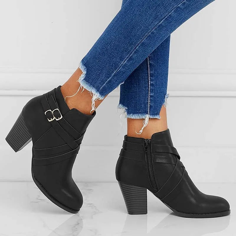 Plus size black short boots with a side zipper, buckle, and a 7cm stout heel on a rubber sole.