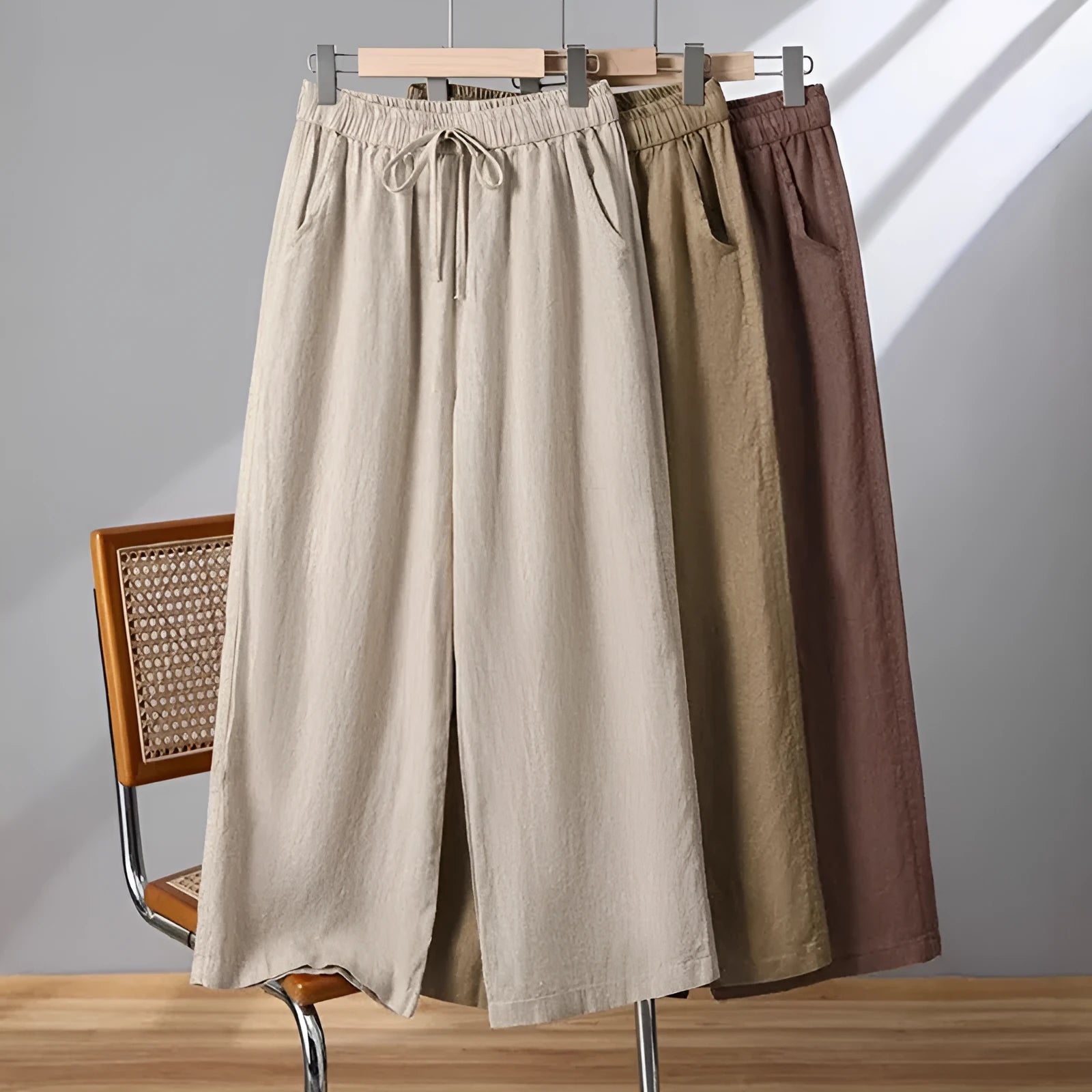 Women's straight-leg casual trousers in apricot colour with elastic waist and lace-up drawstring detail