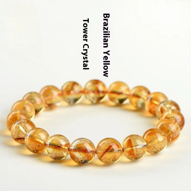 Natural yellow citrine gemstone bead bracelet showing geometrical beads on a string.