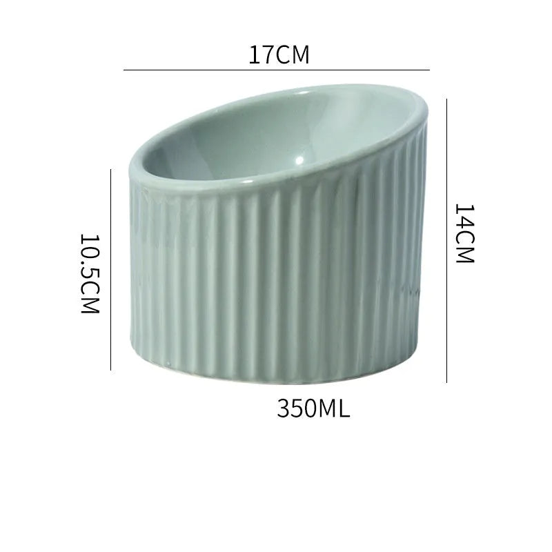 Dark green ceramic elevated cat bowl with tilted, round design for food or water.