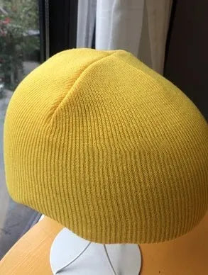 A size L decorative cover for a ski helmet, shown in one of fifteen available colour options.