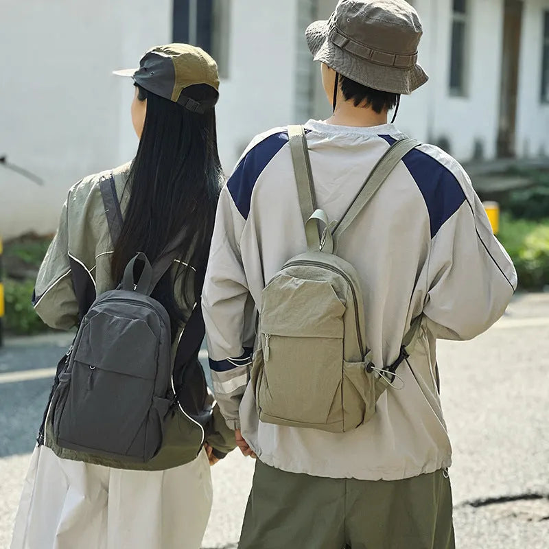 Black multi-functional waterproof nylon backpack with curved shoulder strap, free size, for men and women travel