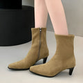 Brown square toe women's ankle boots with a side zip and a mid kitten heel on a waterproof platform sole.