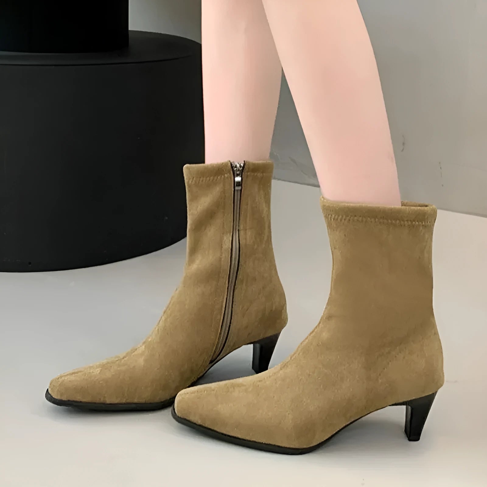 Brown square toe women's ankle boots with a side zip and a mid kitten heel on a waterproof platform sole.