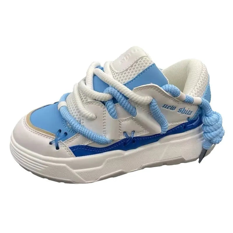 Women's grey retro chunky high-top sneakers with thick rubber platform sole and lace-up front.